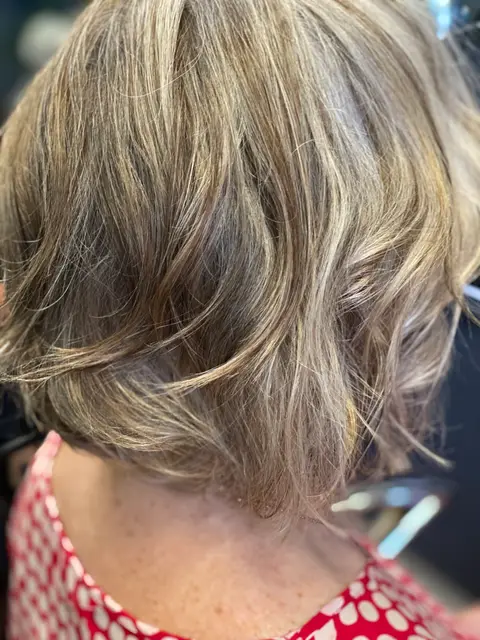 Back view of a grey blended textured bob with soft waves